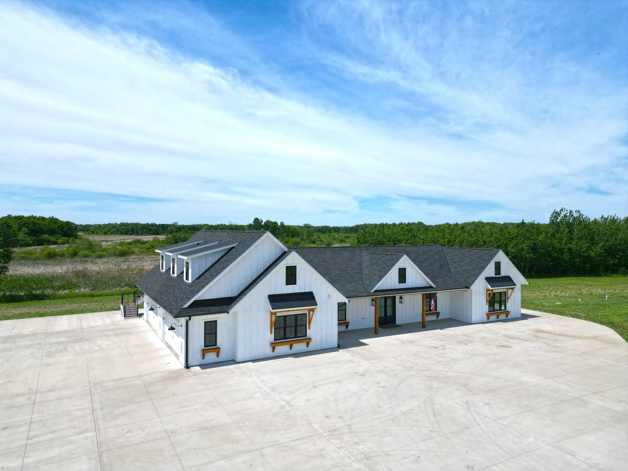 Set on 85 picturesque acres with approximately 35 tillable acres, this exceptional country estate offers privacy, space, and breathtaking views in every direction.