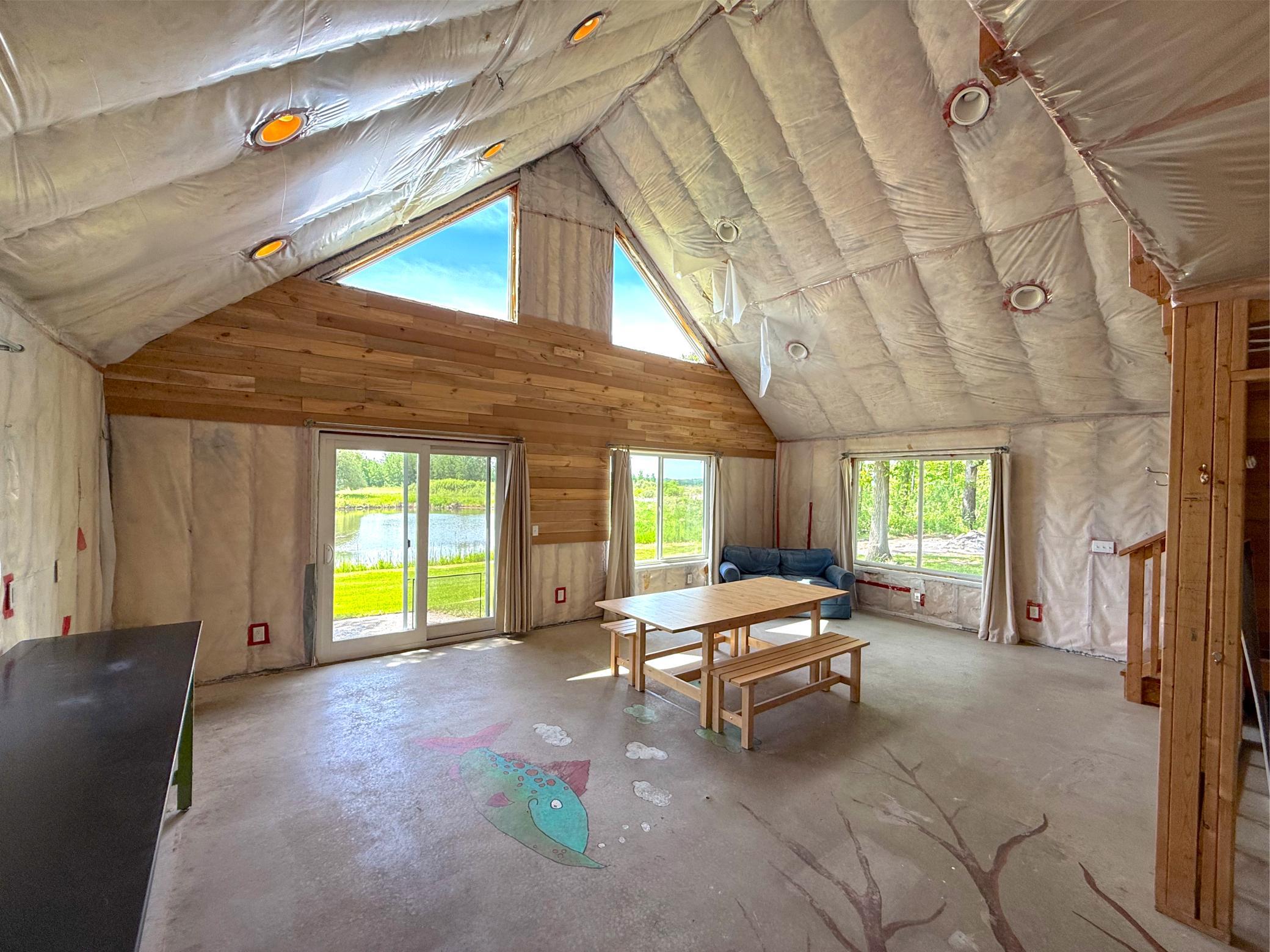 The bunkhouse is completely insulated offering a furnace, spacious loft and full bathroom, just awaiting your final touches.