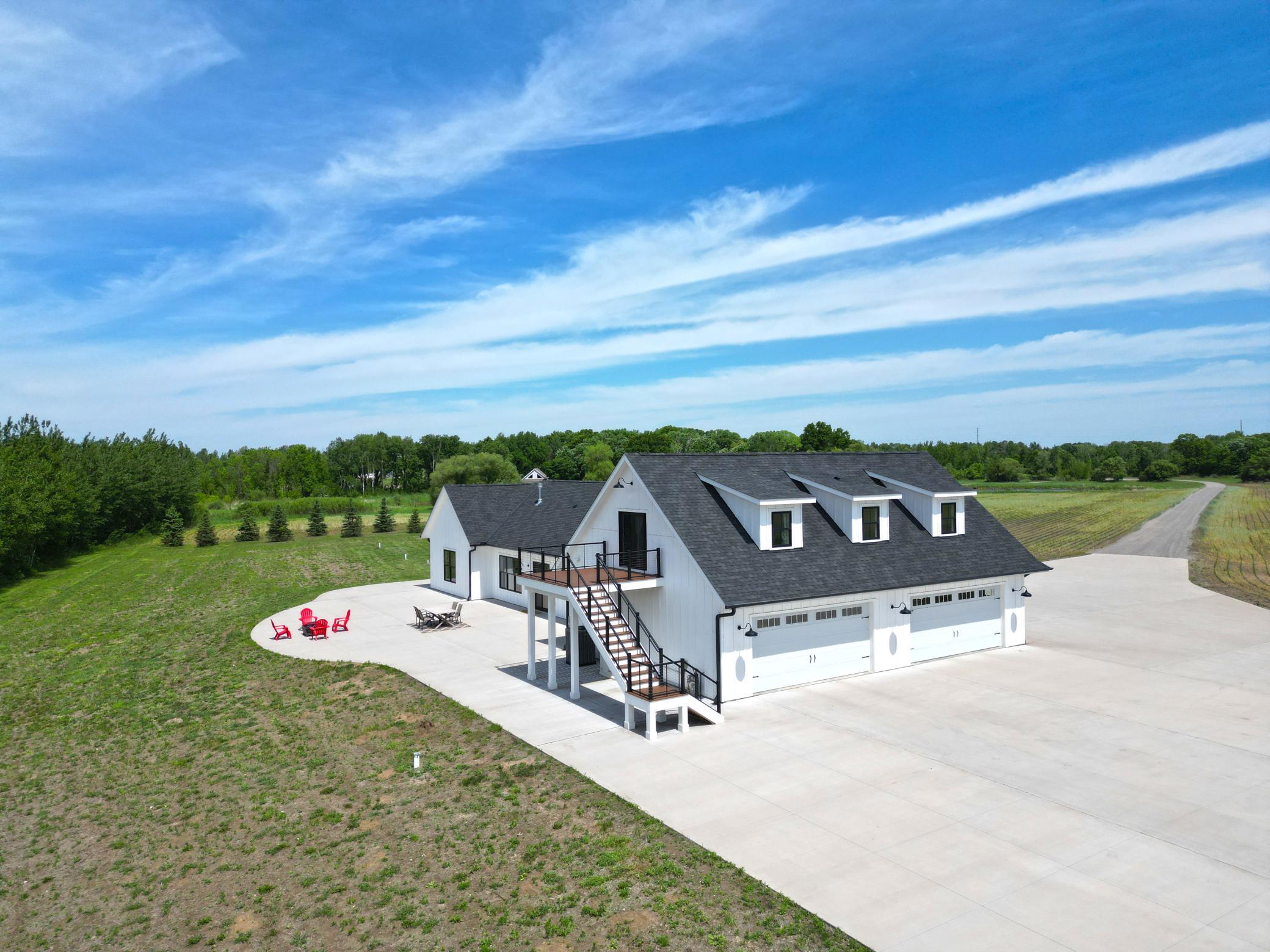 A rare opportunity to own an incredible acreage property that combines modern comfort, productive farmland, scenic ponds, and the tranquility of country living.