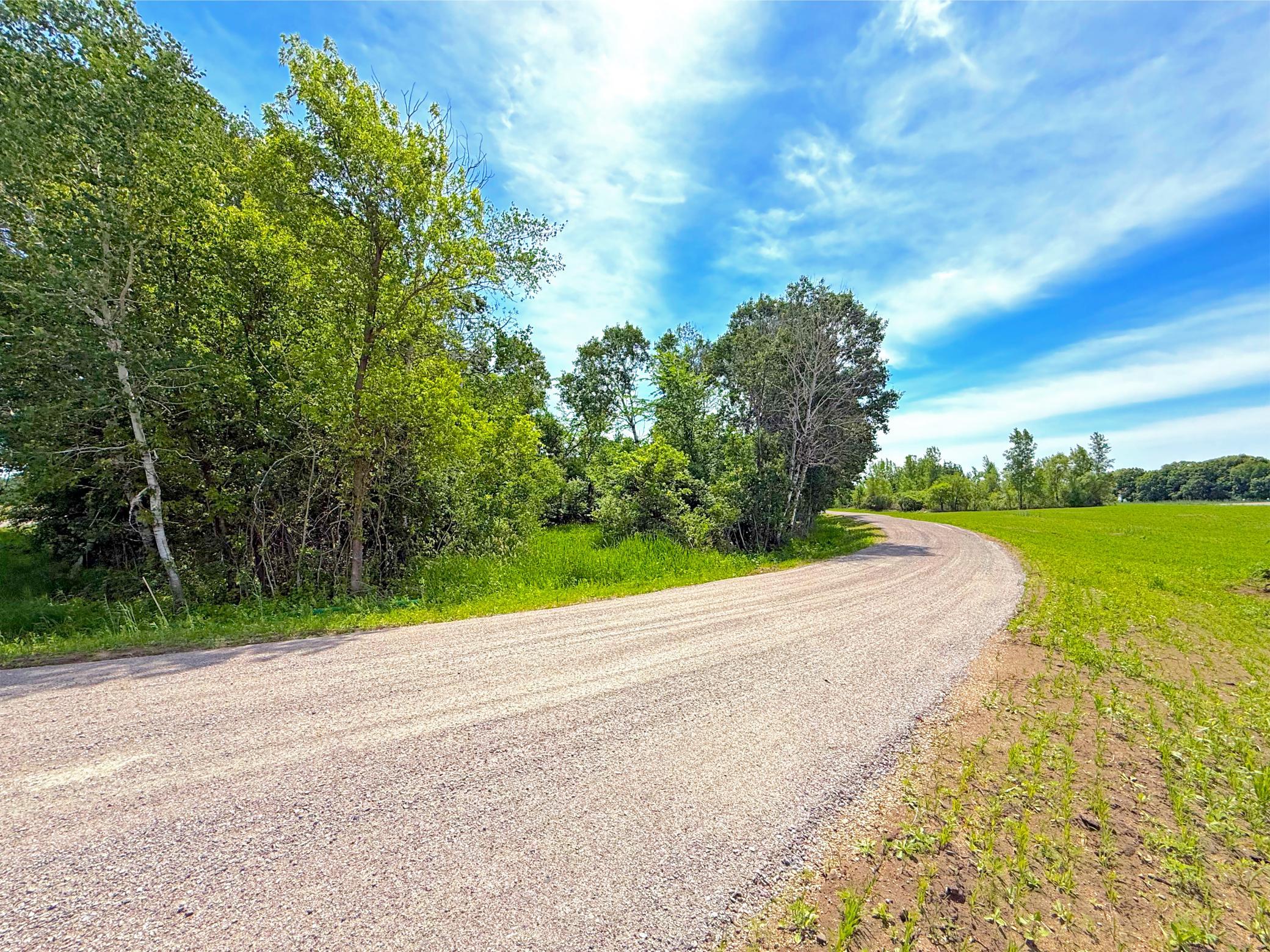 A winding 2,000-foot crushed granite driveway welcomes you to the property, creating a grand approach through rolling countryside and mature trees.
