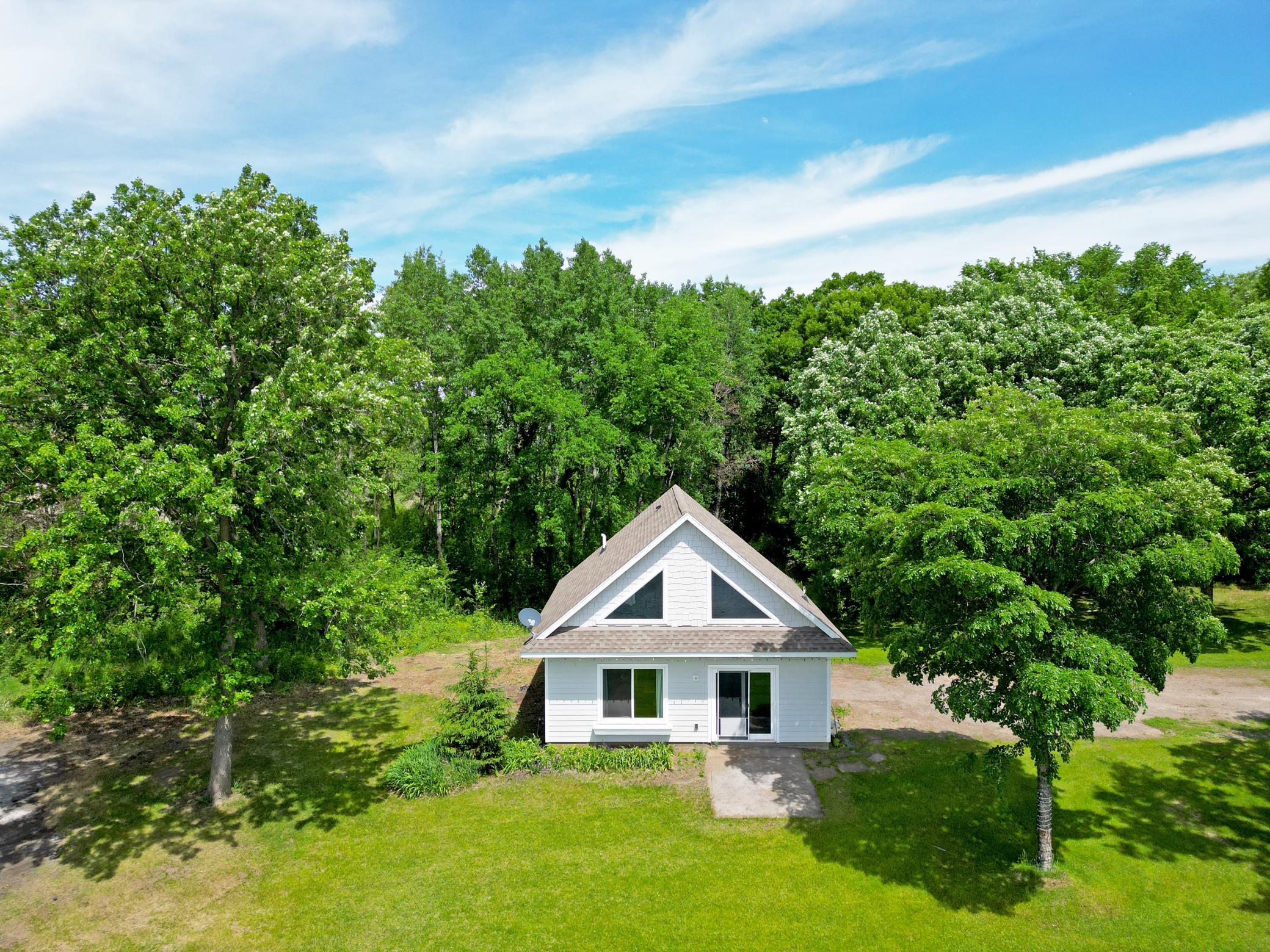 The established Oak trees provide shade, beauty, and a sense of seclusion, creating the perfect backdrop.