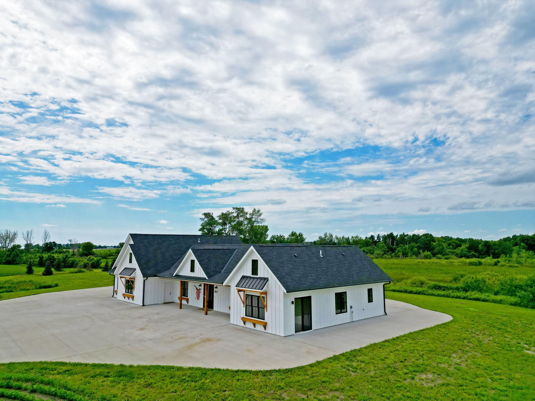 A rare opportunity to own an incredible acreage property that combines modern comfort, productive farmland, scenic ponds, and the tranquility of country living.