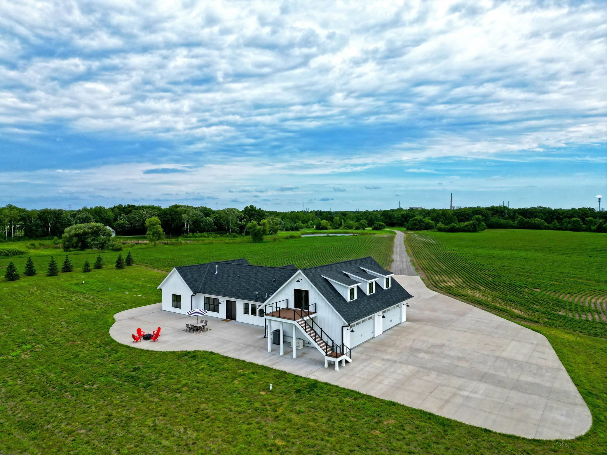 Set on 85 picturesque acres with approximately 35 tillable acres, this exceptional country estate offers privacy, space, and breathtaking views in every direction.
