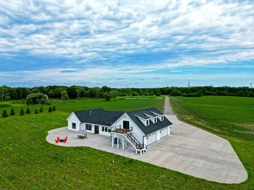 Set on 85 picturesque acres with approximately 35 tillable acres, this exceptional country estate offers privacy, space, and breathtaking views in every direction.