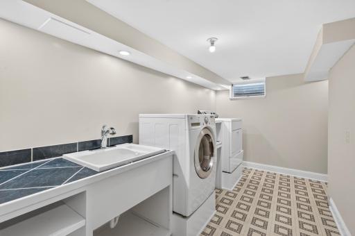 Inviting Laundry room with sink & folding counter
