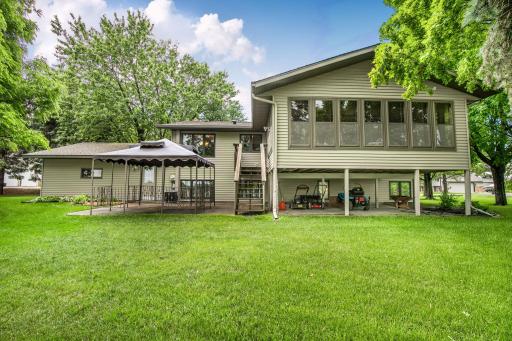 Large lakeside 3 season porch and back patio with additional tuckunder storage for all your lake gear!