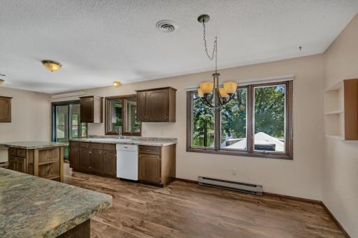 Dining with lake views - new flooring thoughout the kitchen/dining in 2019.