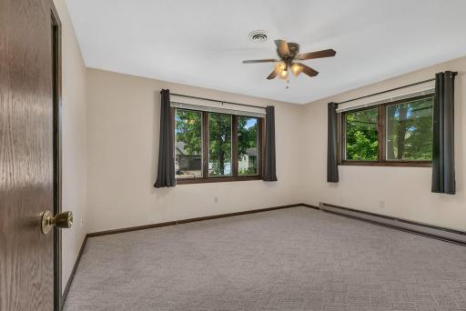 The primary offers lake views and natural light to help you relax after a day on the Course or the Lake.
