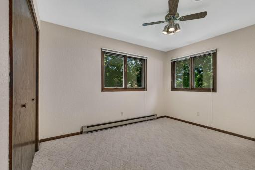 2nd bedroom on the upper level with backyard lake views