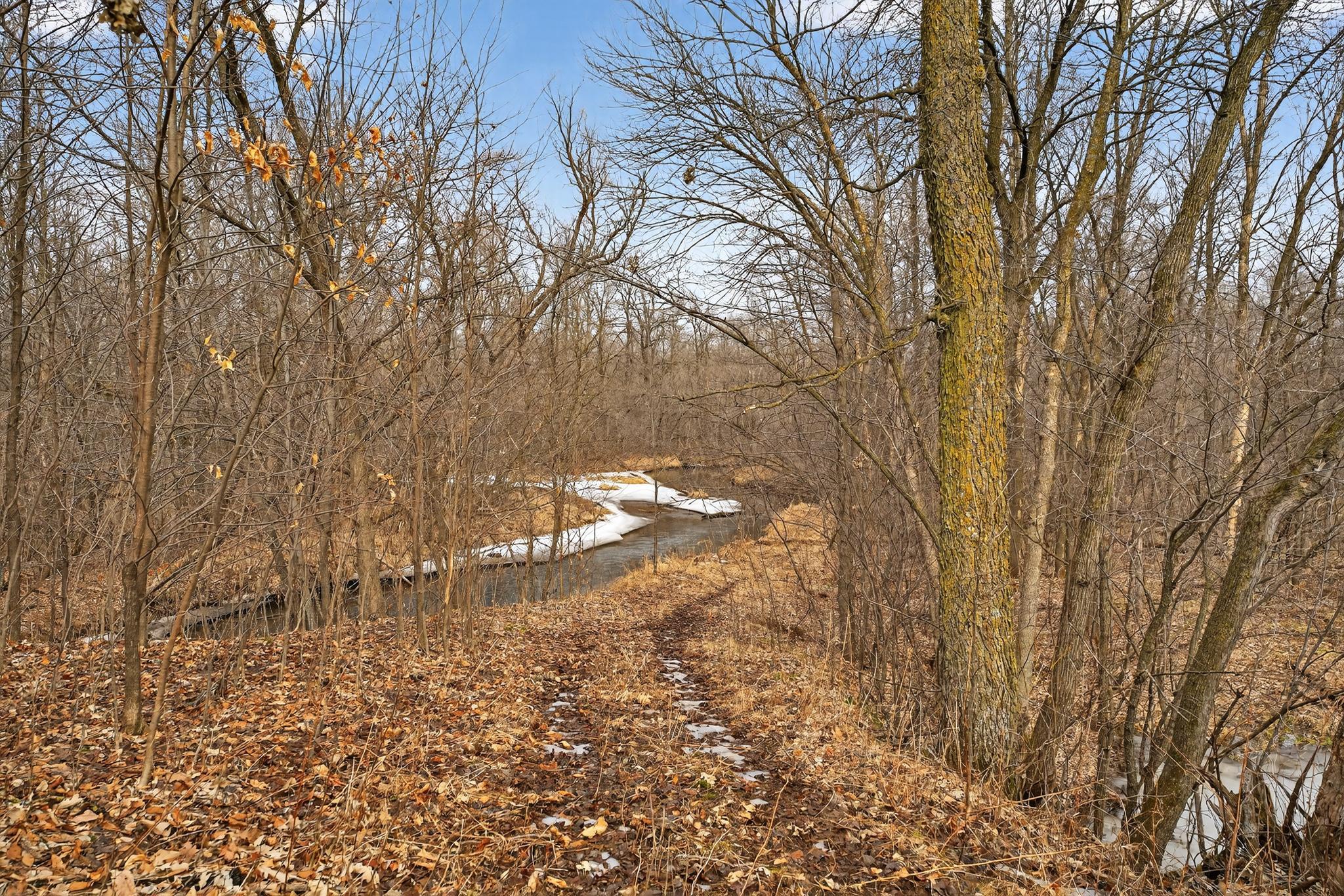 Peaceful view of the surrounding countryside with the Sunrise River flowing through the scenic landscape. Total of 3 - 20-acre parcels available.