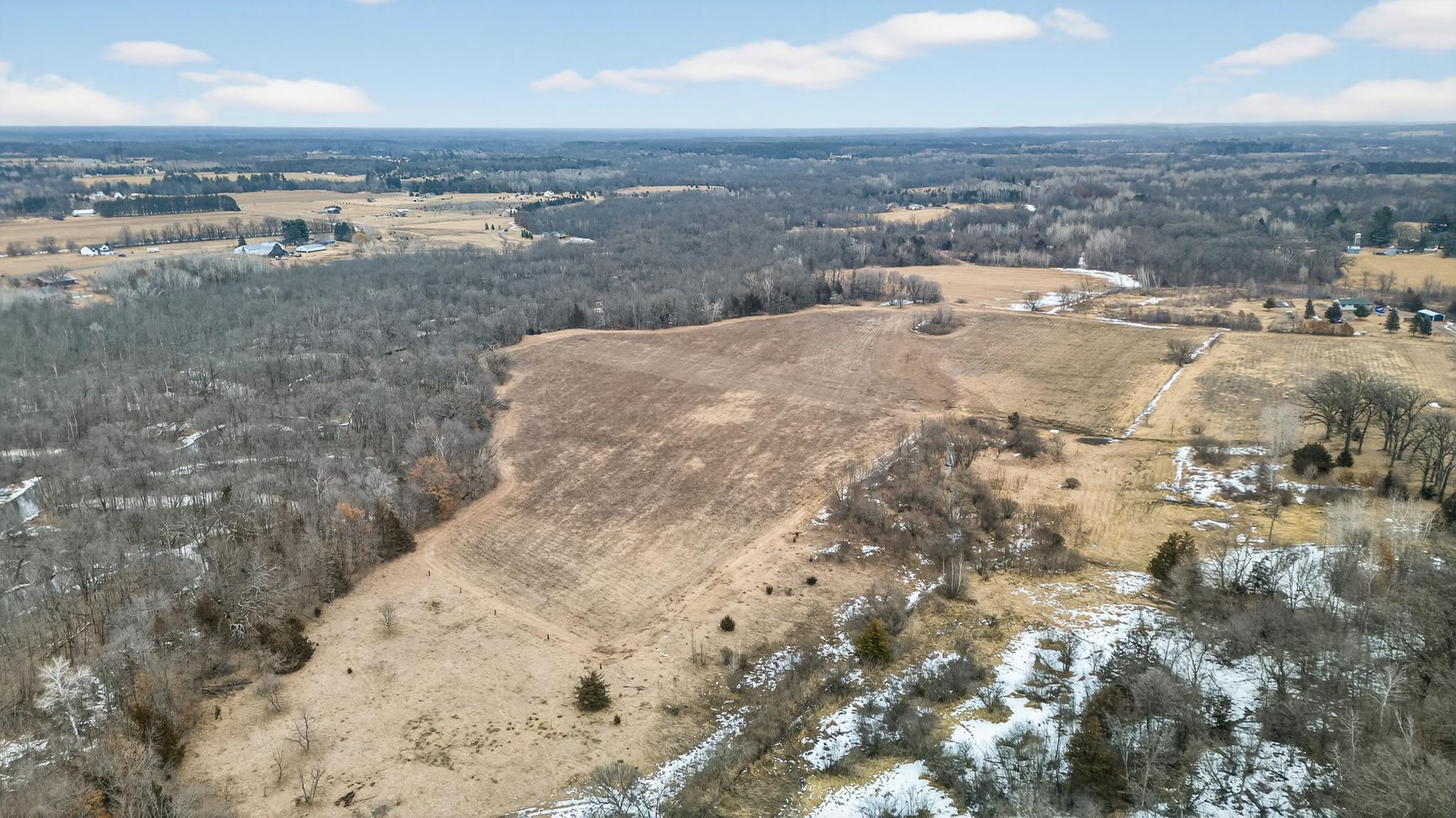 Scenic drone view highlighting the beautiful countryside landscape. Total of 3 - 20-acre parcels available.