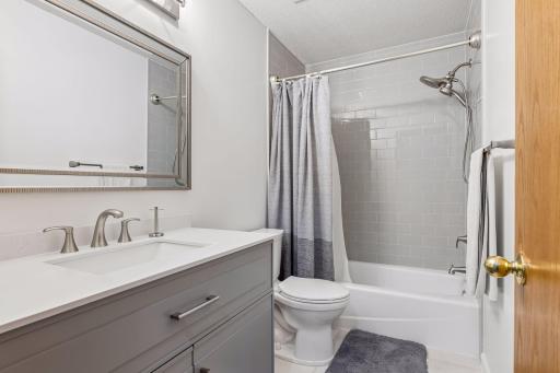 Upper level hall bath was updated by sellers. Sleek and clean, this bathroom is beautiful and serves 3 bedrooms on the upper level.