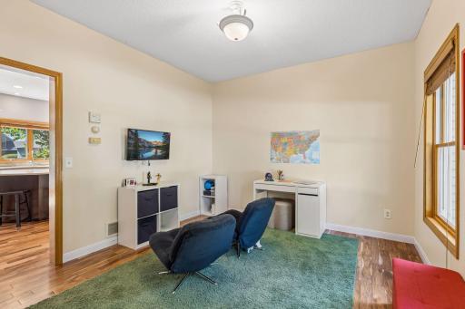 Front room can be a dining room, office, or kid space. It's used for kids to watch TV and play games, as well as do homework at the desk.