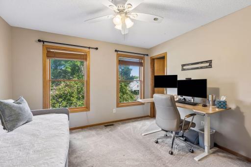 Bedroom 2 is a guest room and currently being used as a work-from-home office. This room has a nice walk-in closet. Beautiful windows. All windows have wood slat blinds.