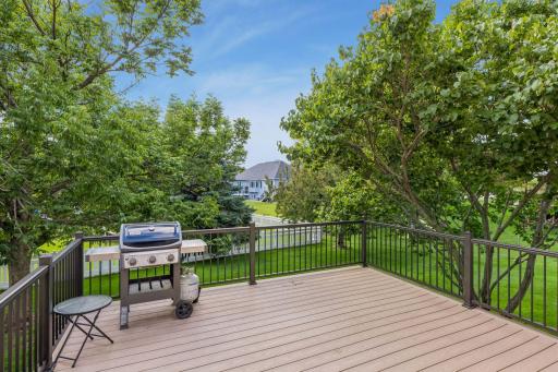 Very large deck with space to grill. Add a table and a seating area.