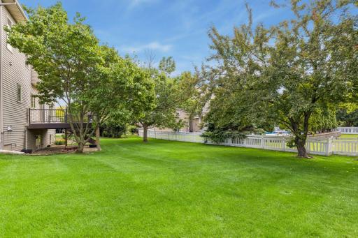 The .38 acre lot curves around from side to side. The yard is wide with lots of room to run and play.