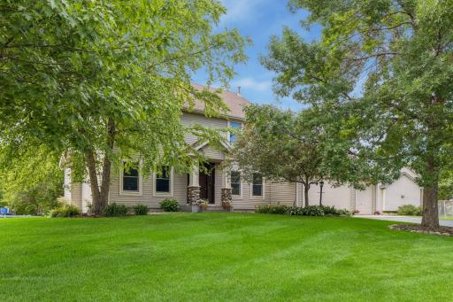 Lush yard with mature trees and great curb appeal