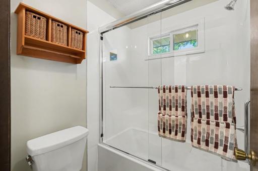 Shower/Toilet is separate, but adjacent to the vanity/sink area.