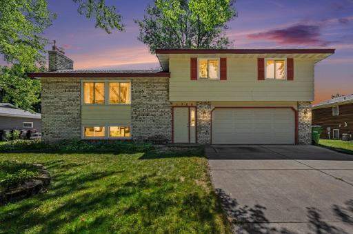 Photo for 1728 132nd Avenue NE, Blaine, MN 55449 - listing #7085908 3 BR Home on a Park! AI-Enhanced Twilight Front Elevation