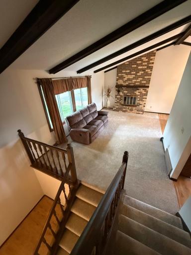 Vaulted Ceiling, Large Picture Window and Fireplace in Living Room AI-Enhanced