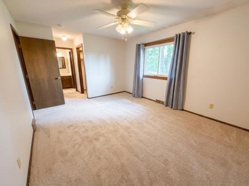 Spacious BR #1 w/ Walk-Through to Bathroom. AI-Enhanced