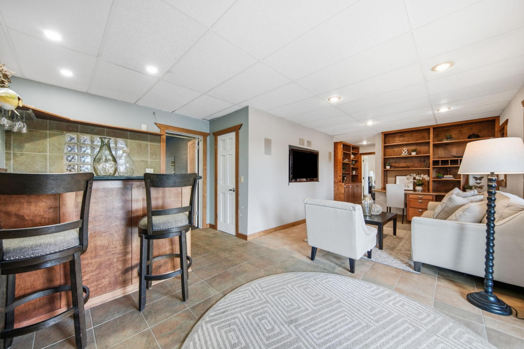 Lower level is ready for entertaining and has direct access to the backyard!