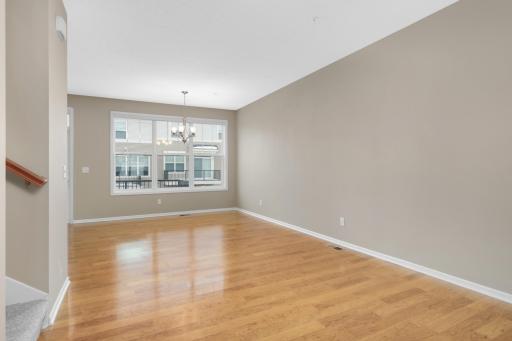 Dining area with plenty of space for hosting, conveniently situated between the kitchen and family room for easy entertaining.