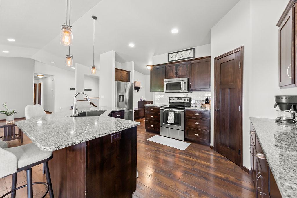 Kitchen - Wendt custom cabinets, granite countertops, pantry, tile backsplash, upgraded stainless steel appliances