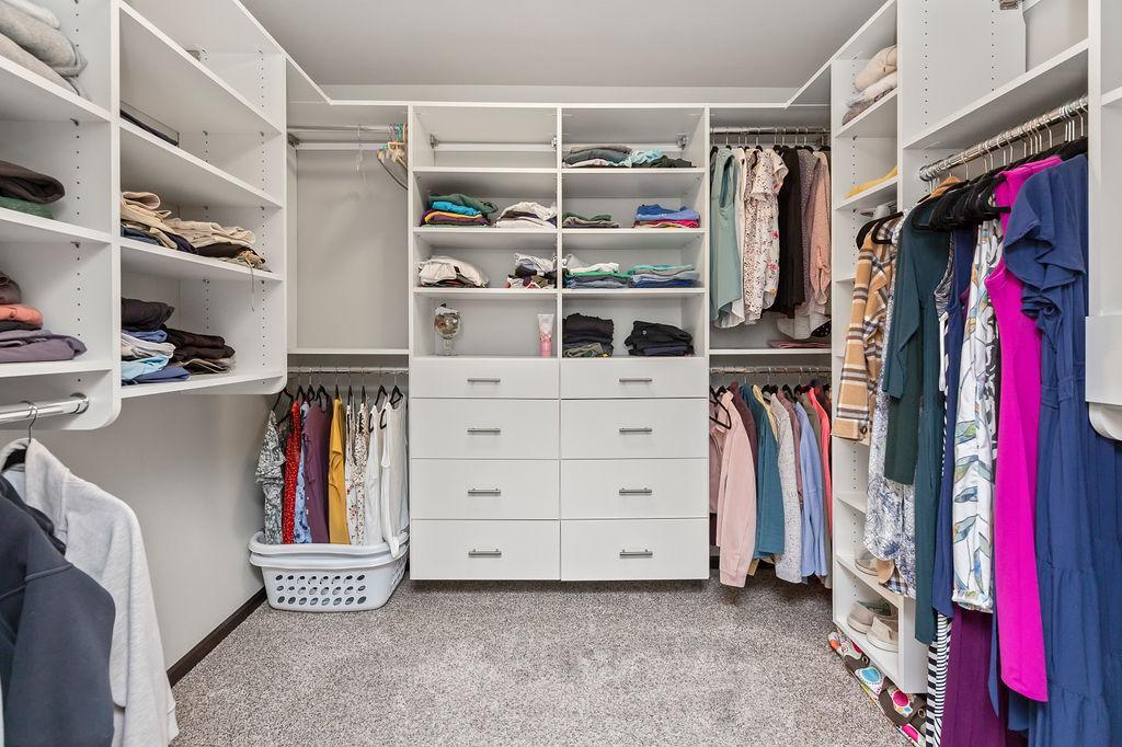 Custom built ins to primary walk in closet