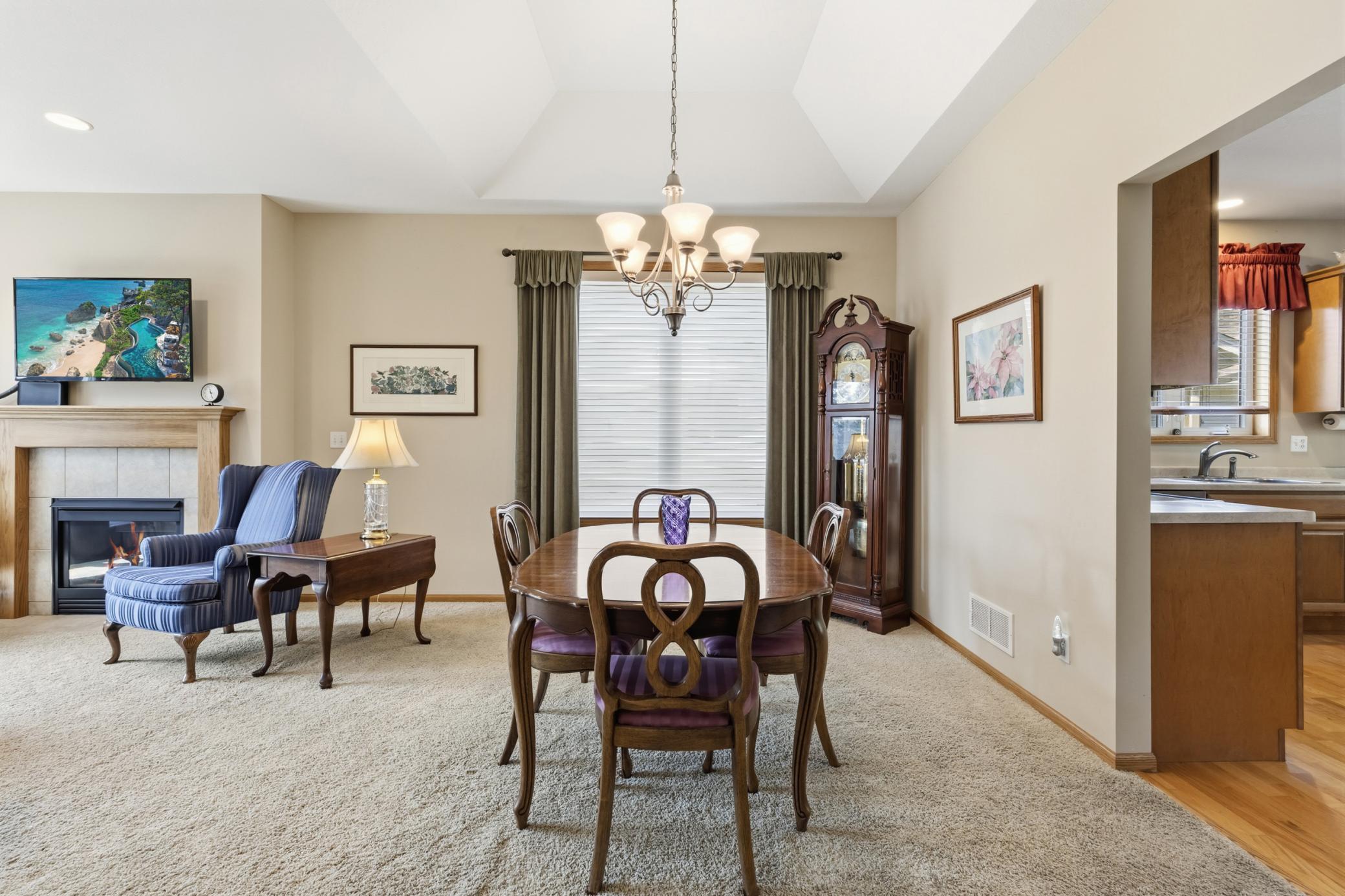 Formal Dining Area with Alcove Ceiling and Open Connection to the Living Room.