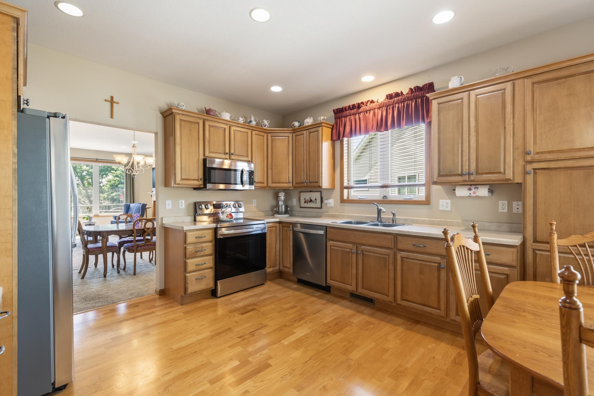Beautiful Kitchen with Abundant Cabinet and Counterspace, Oak Flooring and a Breakfast Nook.