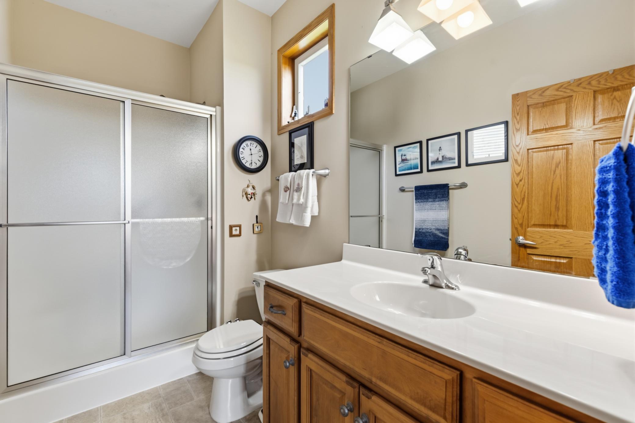 Owner's 3/4 Bath with Lots of Counterspace, a Transom Window and Don't Miss the Linen Closet Behind the Door.