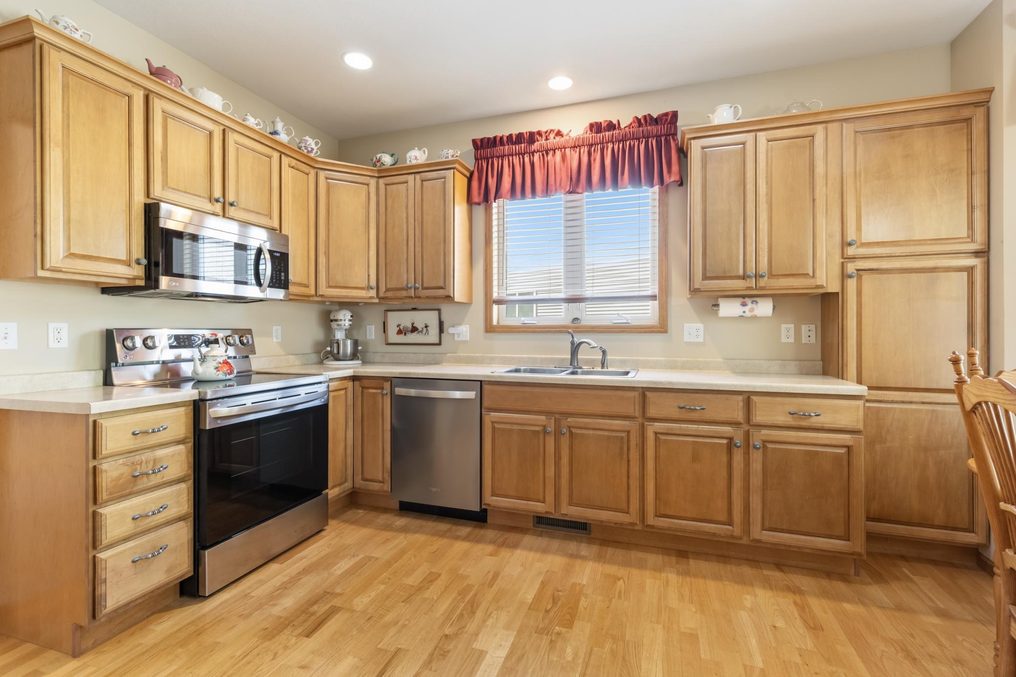 Other Highlights Include the LG Stainless Steel Stove, Microwave and Refrigerator (2020), Whirlpool Dishwasher (2021), Disposal (2022), a Pantry to the Right of the Refrigerator with Pullouts and a Second Pantry, Shown Here at Right.