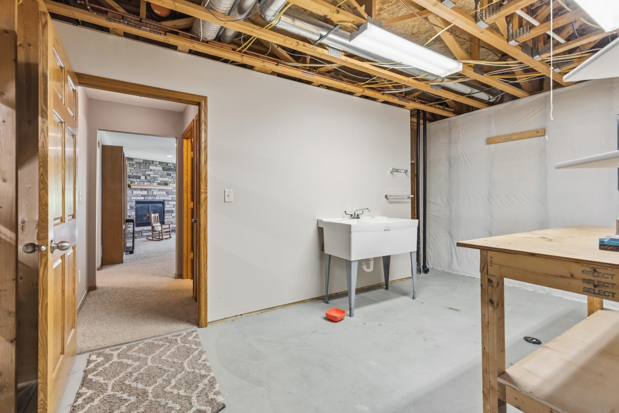 The Shop is Just off the Family Room and a Separate Area from the Utility and Storage Room, with a Wash Basin, Work Bench and Lots of Space for Tools and More.