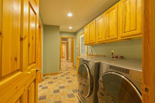 laundry facing the garage entrance and foyer area