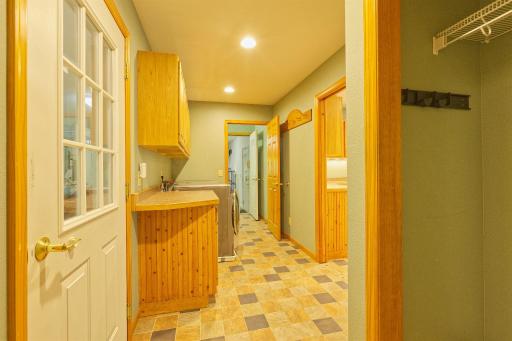 laundry mud room showing both entrances into the garage