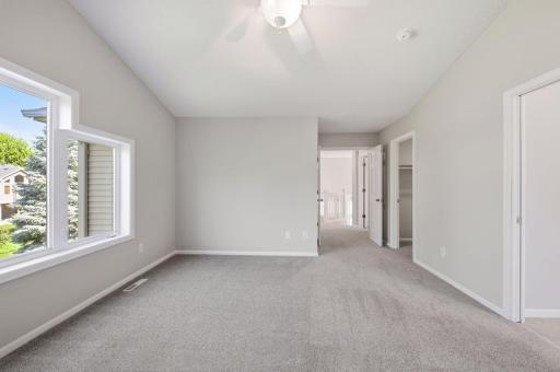 French doors lead to the nicely sized upstairs owner's suite