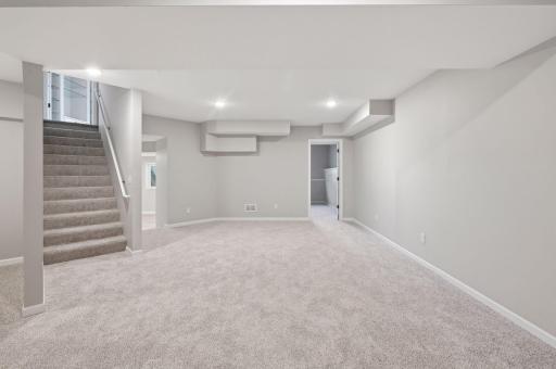 Downstairs features new carpet and expansive sapce for entertainment.