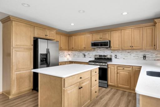 Kitchen - Designed for Everyday Living! Large center island, abundant cabinetry, gas range, and an open layout perfect for entertaining.