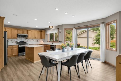 Updated Kitchen! Quartz countertops, Maple cabinetry, tile backsplash, recessed lighting, and Luxury Vinyl Plank flooring installed throughout the Main and Upper Levels in 2022.