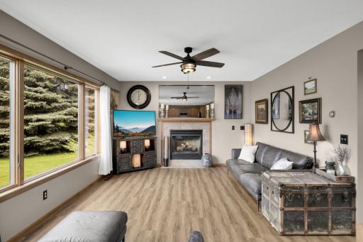 Main Family Room - The Heart of the Home! Relax in the spacious Family Room featuring a cozy Gas Fireplace, large windows, and beautiful views of the private backyard.