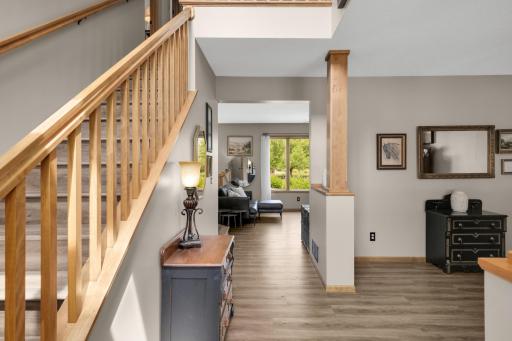 Foyer - Welcome Home! Step inside to soaring ceilings, Maple trim, Luxury Vinyl Plank flooring, and an inviting open layout.