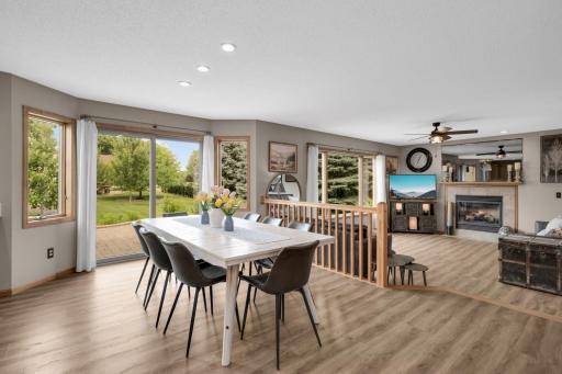 Dining & Family Room - Perfect for Gathering! The open Dining Area flows seamlessly to the Family Room and walks out to the paver patio for easy indoor and outdoor entertaining.