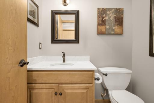 Conveniently located Main Floor half Bath with updated Quartz vanity.