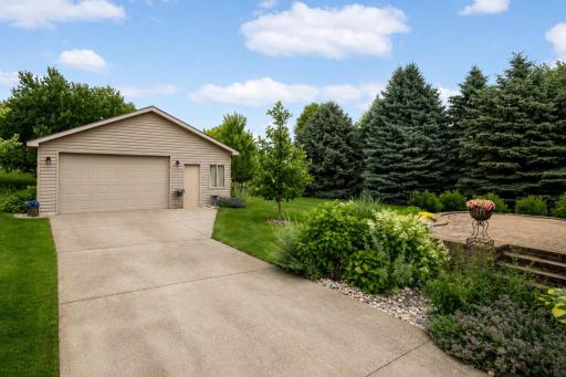 Detached Garage & Patio - Oversized detached garage with an attractive paver patio and beautifully landscaped backyard.