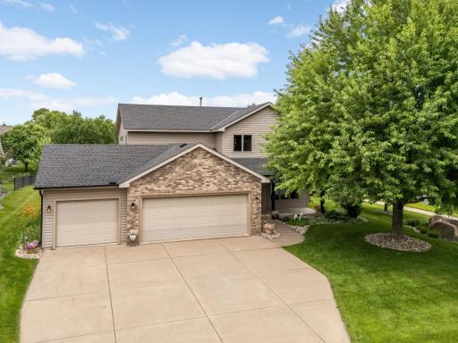 Spacious concrete driveway provides plenty of parking and leads to the attached 3-car Garage, all surrounded by beautifully maintained landscaping.