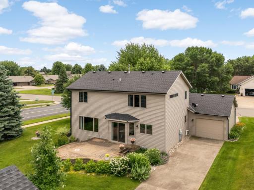 Bird's-eye view highlighting the spacious backyard, screened porch, and extensive landscaping.