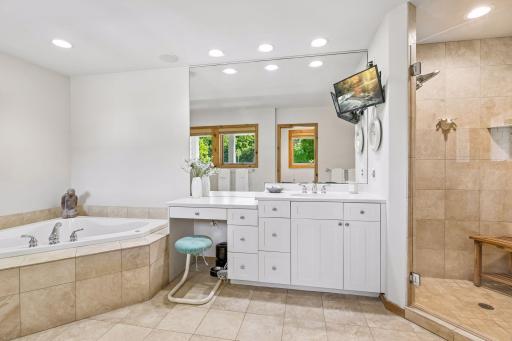 Ensuite primary bath with freshly enameled cabinets