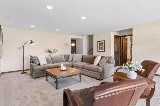 Spacious lower level family room features brand new carpet and paint.