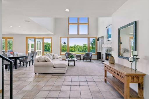 Great Room with "wow" factor view from the front entry - walls of windows frame stunning views.